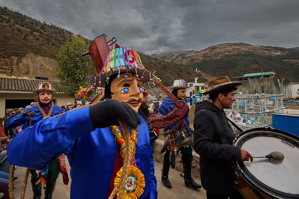 Passionate band performers fill the streets of Paucartambo with powerful melodies during the Virgen del Carmen celebrations, blending devotion, tradition, and vibrant festivity
