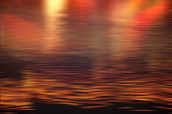都市の夜のモーションウェーブライトの赤と金色の輝き線をぼかす — ストック写真