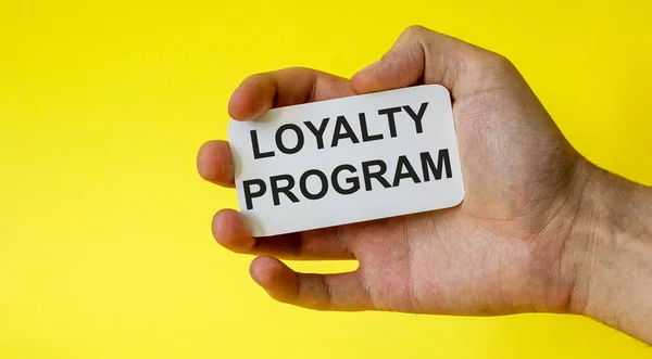 Программа Лояльности Карточка Руке Изолированы Желтом Фоне — стоковое фото