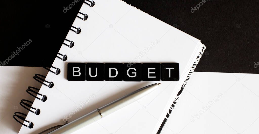 Business Words on notepad. Work business tex Budget with pen