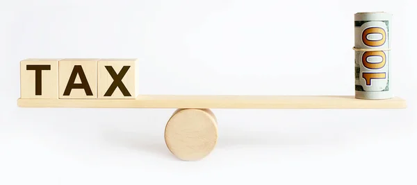 Seesaw Showing Balance Money Word Tax Balance Concept — Stock Photo, Image