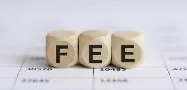 Text FEE on wooden cube blocks