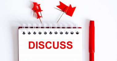 Not defterine DISCUSS sözcüğü ofis araçlarıyla yazılmıştır. İş konsepti