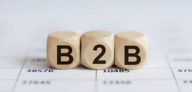 Grafik arkaplanındaki tahta küp blokları üzerine metin B2B