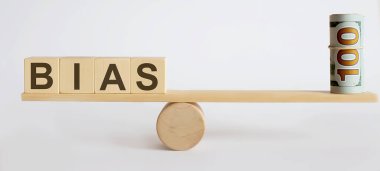 Para ve BIAS arasındaki dengeyi gösteren tahterevalli. Denge kavramı