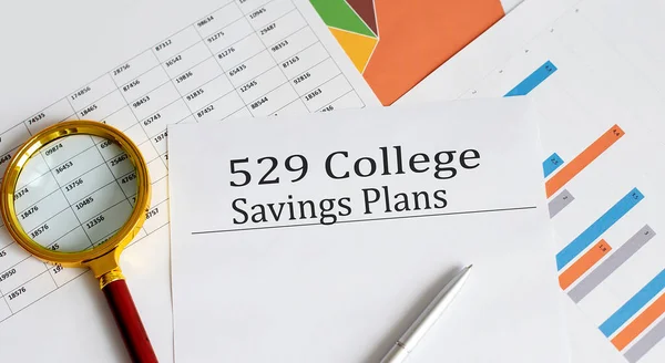 529 College Saving Plans text on the cart. Business and finance concept.