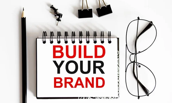 Вид Зверху Олівець Окуляри Блокнот Написаний Build Your Brand Білому — стокове фото