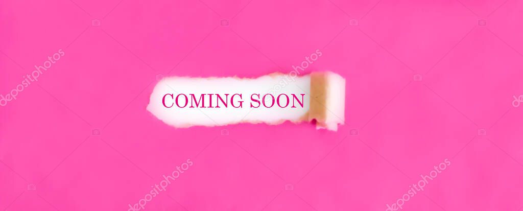Text COMING SOON appearing behind torn pink paper.