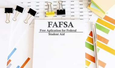 Paper with Corrective and Preventive FAFSA action plans on table with charts clipart