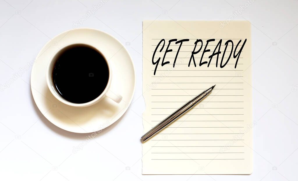 GET READY - white paper with pen and coffee on the white background
