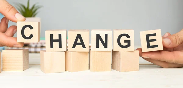 Businessman points to wooden blocks with the word Change to Chance. Personal development. Career growth or change yourself concept. Motivation, goal achievement, potential, incentive, overcoming