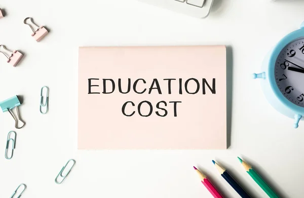 EDUCATION COST text on notepad on the white background