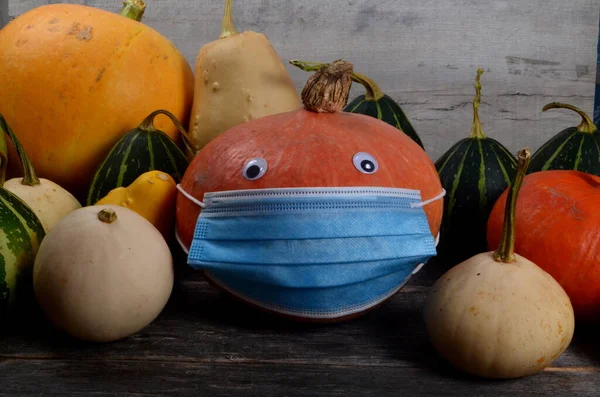 Coronavirus Halloween Pumpkin. Halloween pumpkins with face mask.