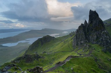 Rainbow by the Old Man of Storr at the Isle of Skye. Hiking in the Quairing Mountains on the Isle of Skye in Scotland clipart