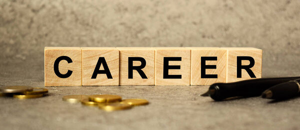 The inscription stess on the texture of wooden cubes on the background of manet. An inscription on a financial, business or economic theme.