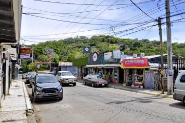 Santa Elena, Costa Rica - March 12, 2018: The main street of San Elena a small mountain town near Monteverde, Costa Rica. This town is the jumping of point into the Cloud Forests of Monteverde. clipart