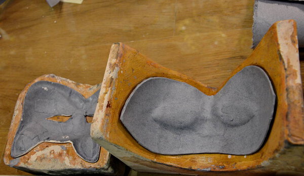 Venetian paper mache masks in moulds in Venice, Italy