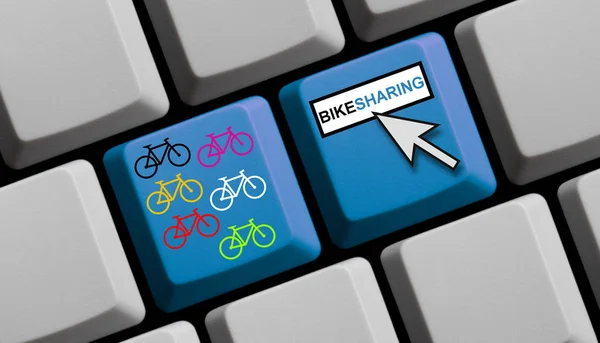 Computer Keyboard with Mouse arrow and colorful bikes showing Bikesharing