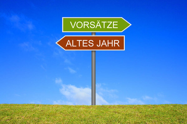 Signpost outside is showing Old Year and Intentions in german language