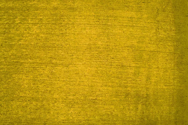 Textura de parede de concreto amarelo sujo — Fotografia de Stock