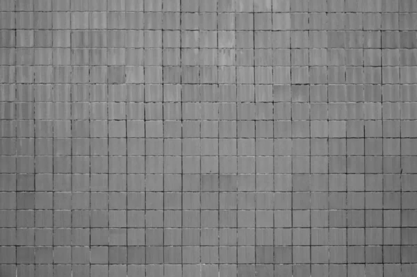 Старая кирпичная стена с серой текстурой — стоковое фото