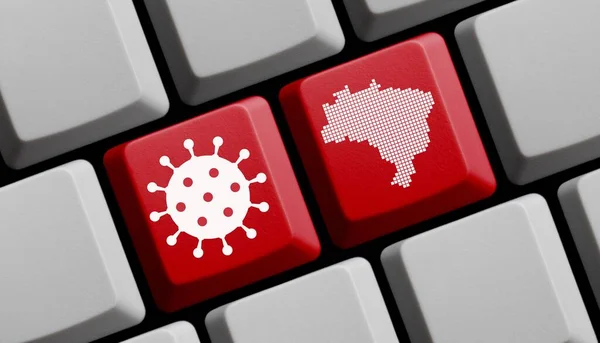 Computer keyboard with coronavirus icon and silhouette of Brazil