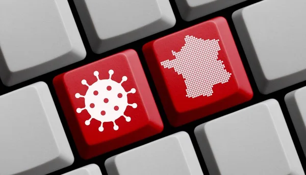 コロナウイルスのアイコンとフランスのシルエットを持つコンピュータのキーボード — ストック写真