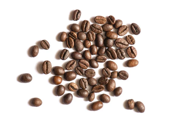 A handful of brown toasted aromatic and deliciously smelling coffee beans on white