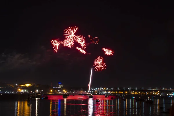 Fireworks of many red flowers and hearts drawn from them on the anniversary of the city of Kostroma