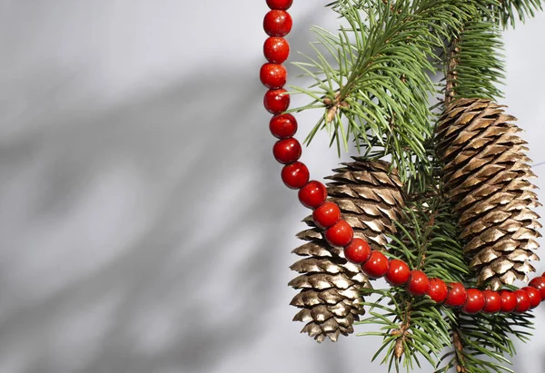 Golden Cones Christmas Tree Dressed Beautiful Red Beads Light Background Stock Picture