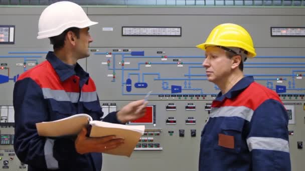 Two engineers near main control panel — Stock Video
