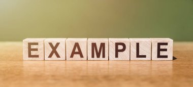 Tahta masadaki tahta bloklara yazılmış örnek kelime. Tasarımınız için kavram