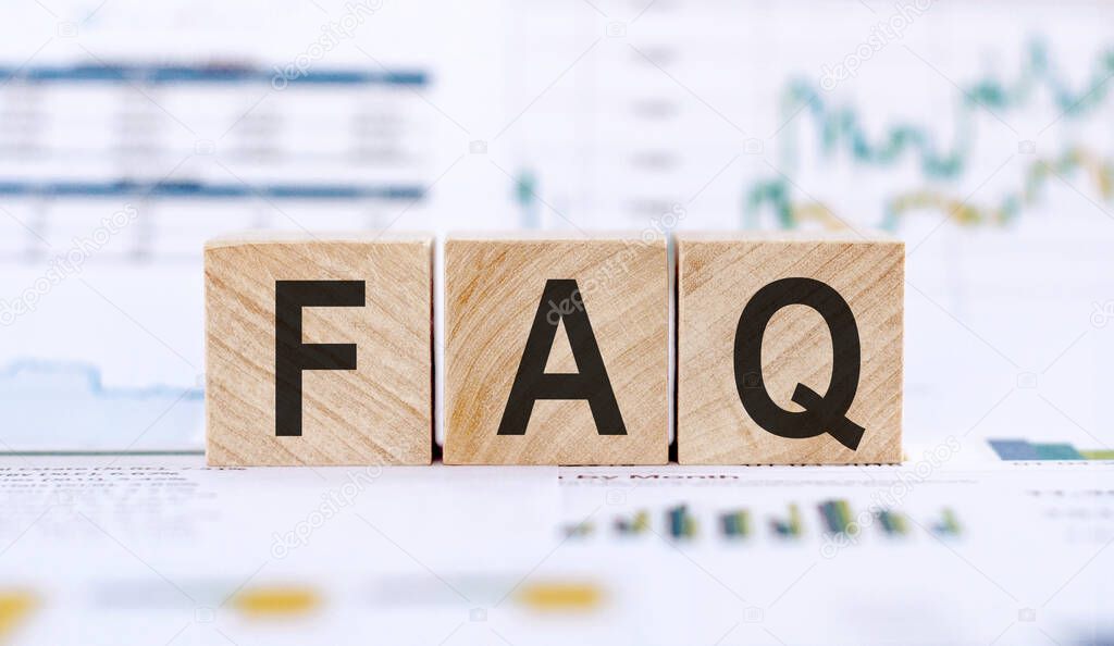 FAQ the word on wooden cubes in the background is a business diagram. Business and finance concept