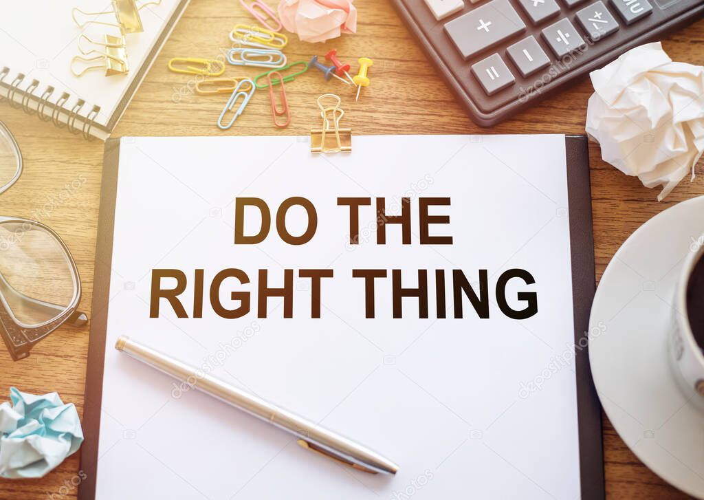 The phrase Do The Right Thing typed on a paper on office table. A reminder to make the right choices according to your moral compass.