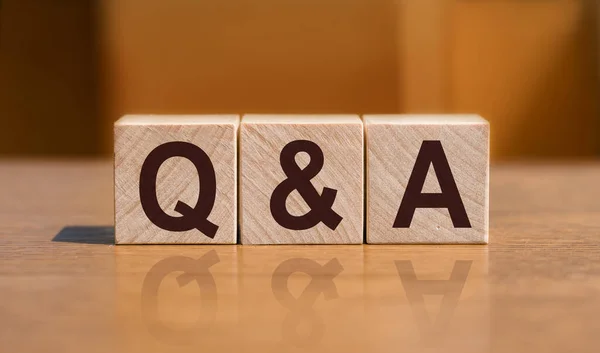 Q&A or Questions and answers text on wooden blocks