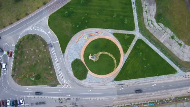 Aerial crossroads with a road for cars and a bike path. — Stock Video