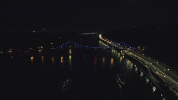 Aerial view from Drone: Top view of the night promenade with bridges and cars. — Stock Video