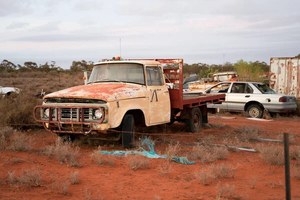 Rusty Abandoned Truck in the Australian Outback. Wreck Vehicles in desert scrapyard in Australia