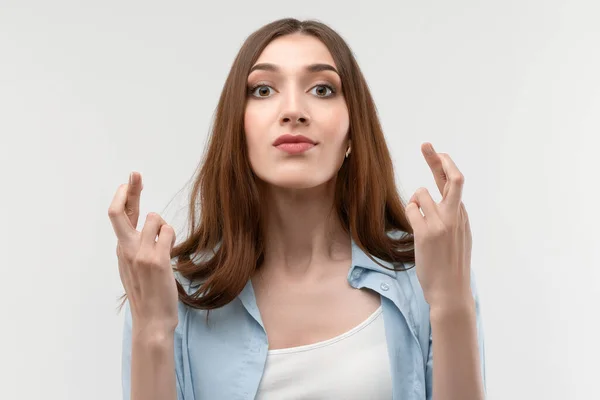 Joyful Young Brunette Female Long Straight Hair Crosses Fingers Makes — Stock Photo, Image