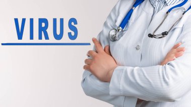 Beyaz arka planda kelime virüsü. Yakınlarda beyaz önlüklü ve steteskoplu bir doktor var. Tıbbi konsept