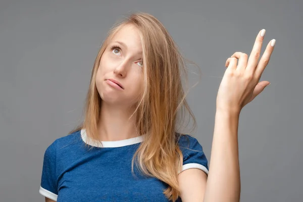 Funny Young Blonde Female Shoots Temple Looks Shows Tiredness Dressed — Stock Photo, Image