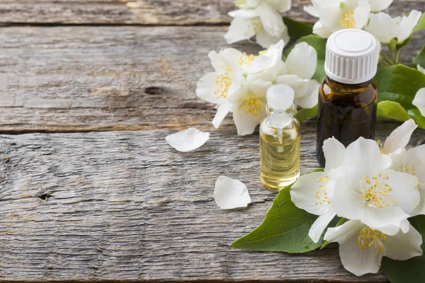 Oil of jasmine. Aromatherapy with jasmine oil. Jasmine flowers.