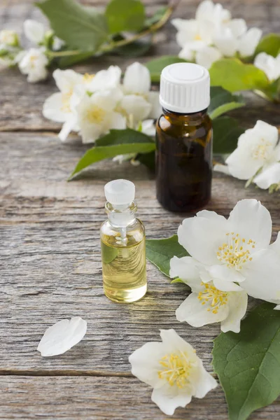 Oil of jasmine. Aromatherapy with jasmine oil. Jasmine flowers.