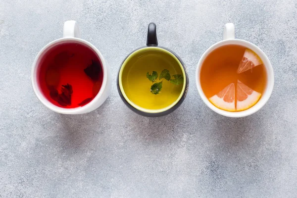 Cups Different Tea Red Green Black Grey Table — Stock Photo, Image