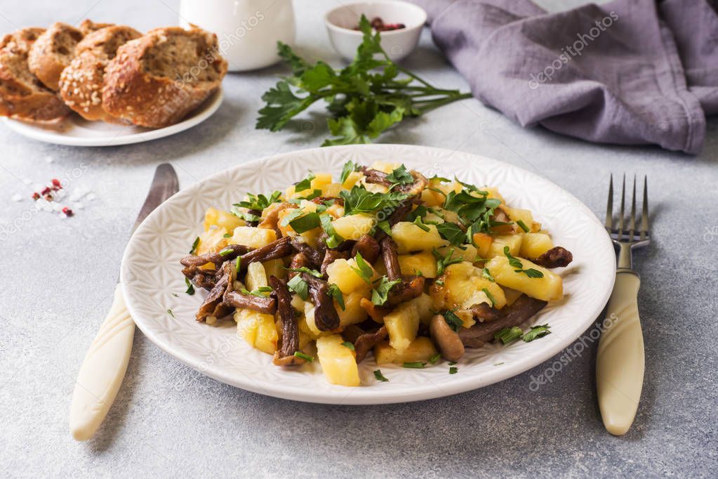 Fried potatoes with mushrooms and fresh herbs