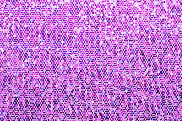 Pink purple background. Abstraction shiny sequins. Sequins texture closeup macro.