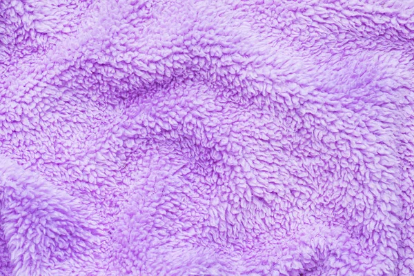 Het patroon van het paarse zacht materiaal. Achtergrond details badstof. — Stockfoto