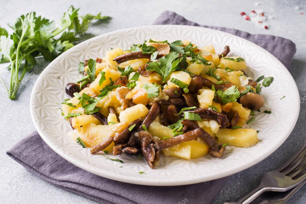 Fried potatoes with mushrooms and fresh herbs.