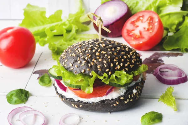 Vegetarian Burger with cottage cheese cream and vegetables.