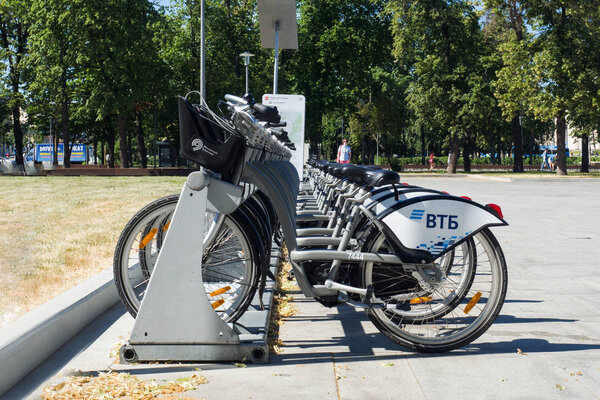 Moscow, Russia - June 24, 2019: Row of rental city bicycles provided by VTB Bank with logo. Moscow road and transport infrastructure